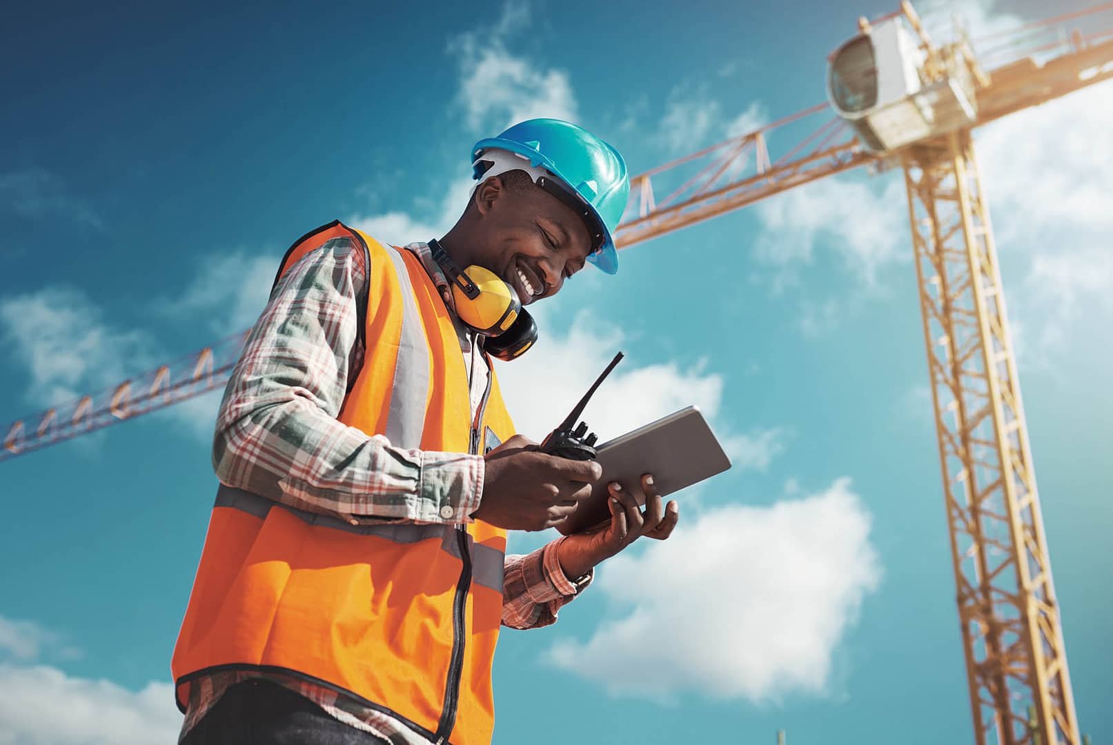 New age tech for new age construction. Shot of a young man using a digital tablet while working at a construction site.